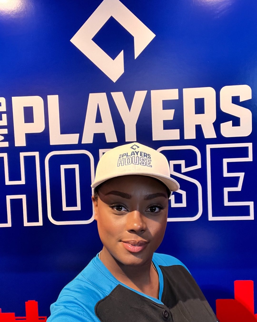 Belizean creator Micah wearing official MLB gear at the MLB Players House inside Troy’s Live during MLB Weekend Arlington Texas 2024.